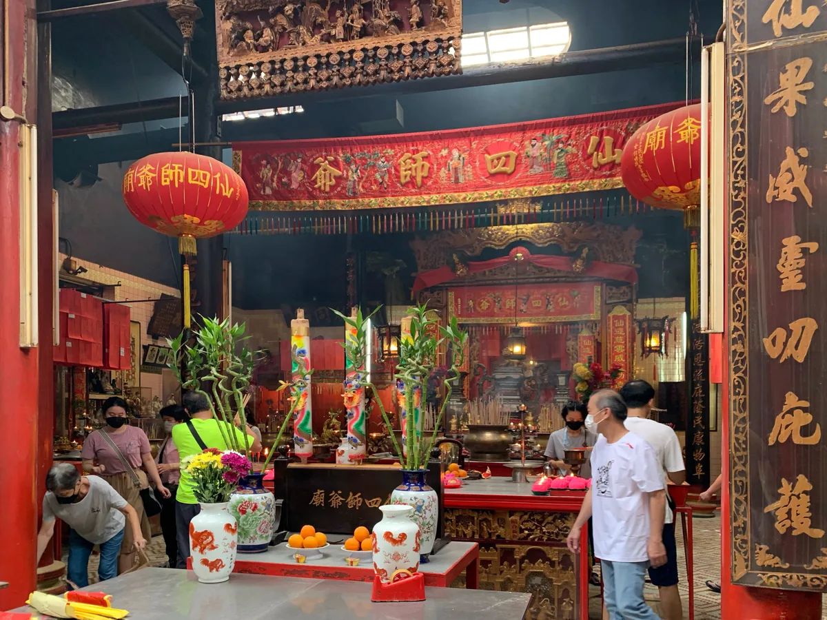Sin Sze Si Ya Temple in Kuala Lumpur - A snug wooden shrine squeezed into a turn-of-the-century shopfront along Jalan...