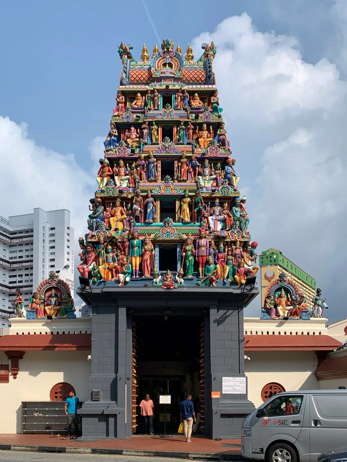Sri Mariamman Temple in Singapore - A Hindu temple crowned by a tall, colourful gopura tower packed with painted...