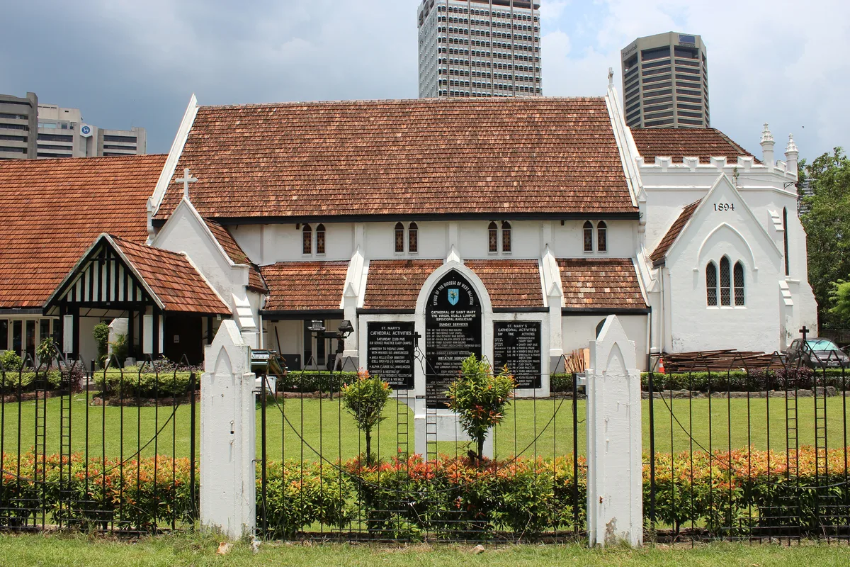St. Mary's Cathedral in Kuala Lumpur - A red-brick Gothic Revival Anglican church with sharp pointed windows, a...