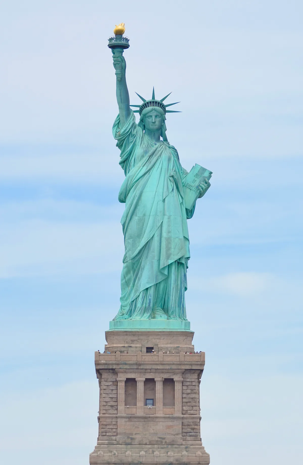 Statue of Liberty in New York - A 93-metre copper statue of a robed woman holding a torch aloft, standing on Liberty...