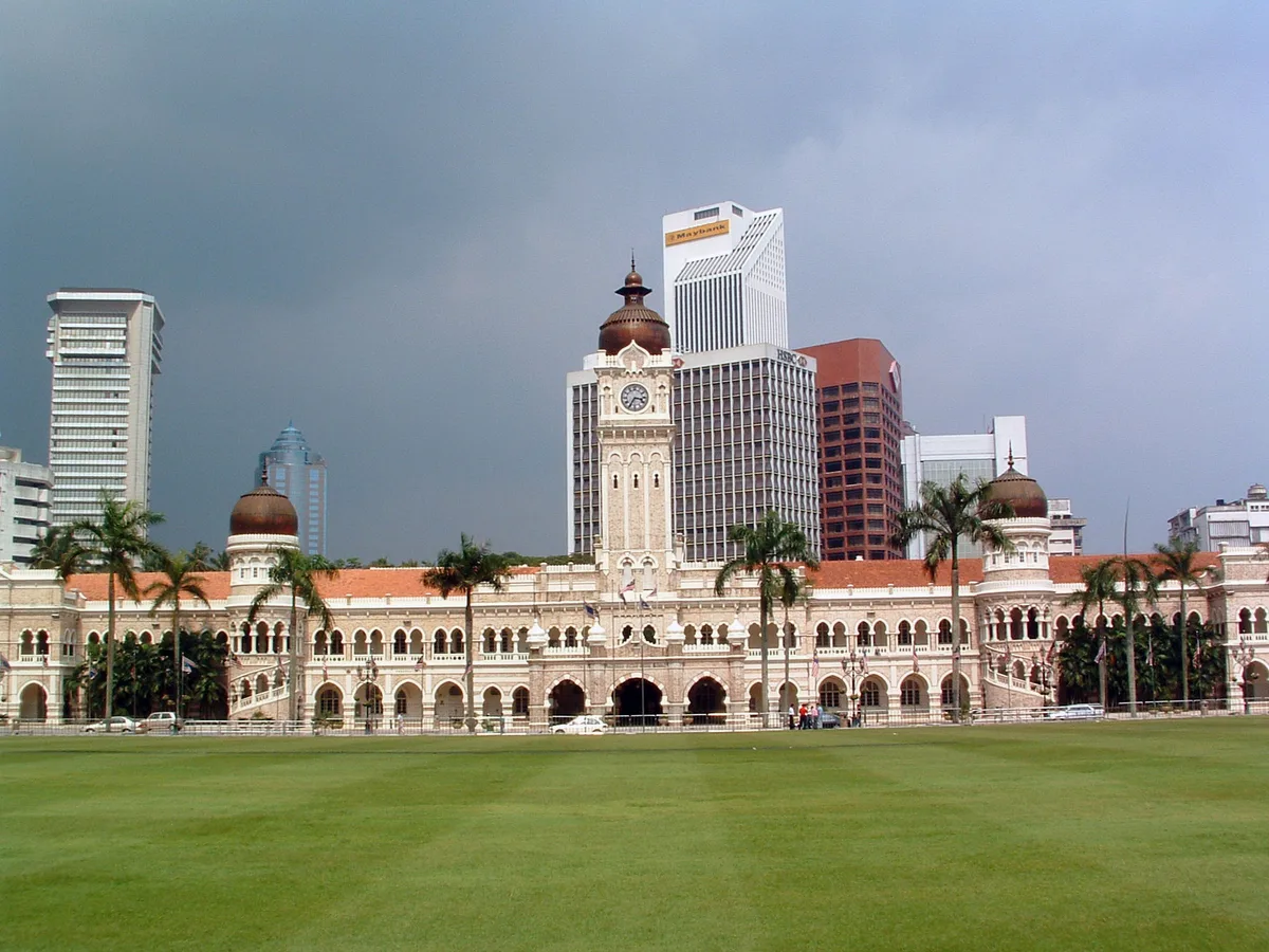 Sultan Abdul Samad Building in Kuala Lumpur - A long cream-and-brick façade running along Jalan Raja, its rhythm of...