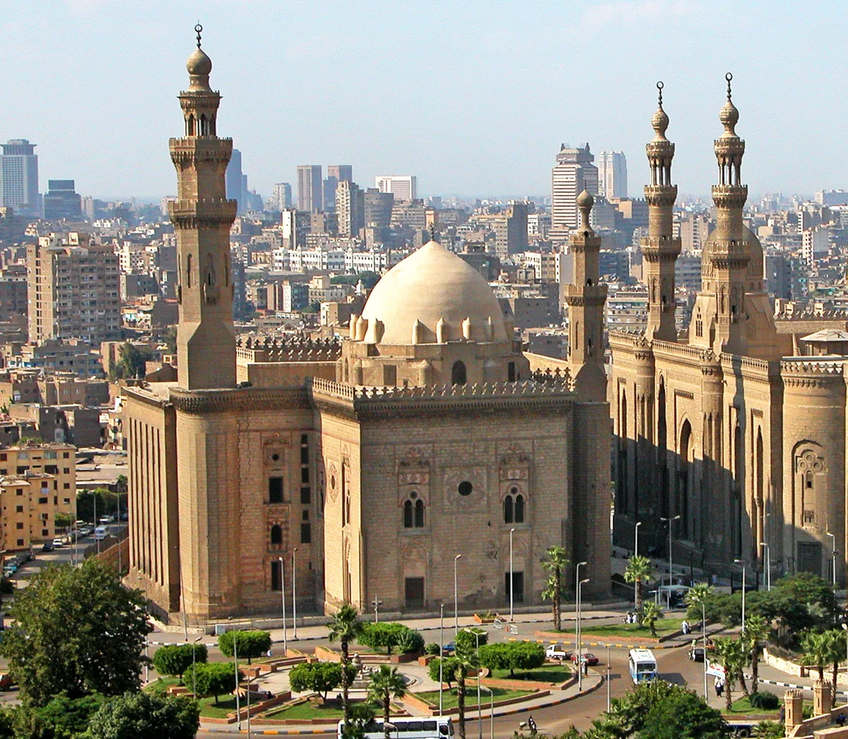 Sultan Hassan Mosque-Madrasa in Cairo - A monumental Mamluk mosque with a towering 38-metre entrance portal, four iwans...