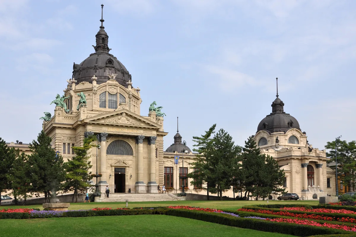 Szechenyi Thermal Bath in Budapest - A colossal ochre-yellow neo-Baroque bath palace in the City Park, its monumental...