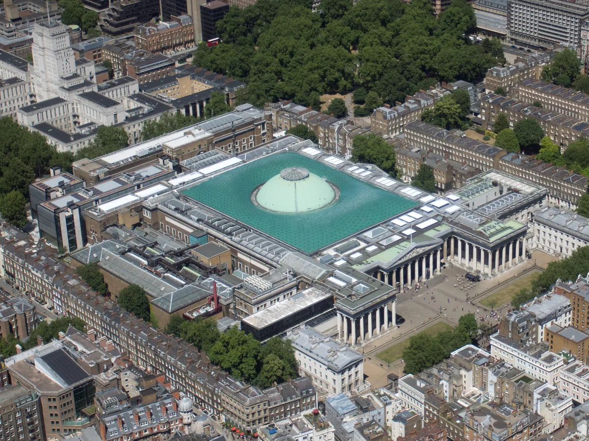 The British Museum in London - A grand Neoclassical building with a 44-column Ionic portico, surrounding the Great...