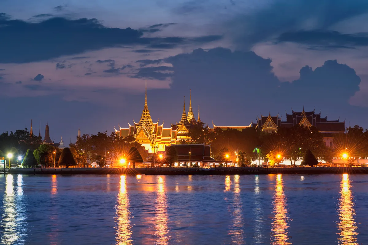 The Grand Palace in Bangkok - A sprawling complex of over 100 ornate buildings with gilded spires, colourful...