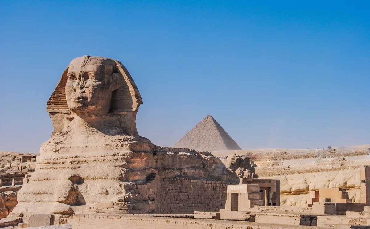 The Great Sphinx in Cairo - A massive limestone statue with a human head and a lion's body, 73 metres long and 20...