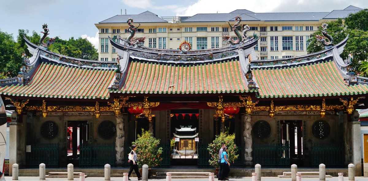 Thian Hock Keng Temple in Singapore - A richly decorated Chinese temple with sweeping tiled roofs and gilded ridge...