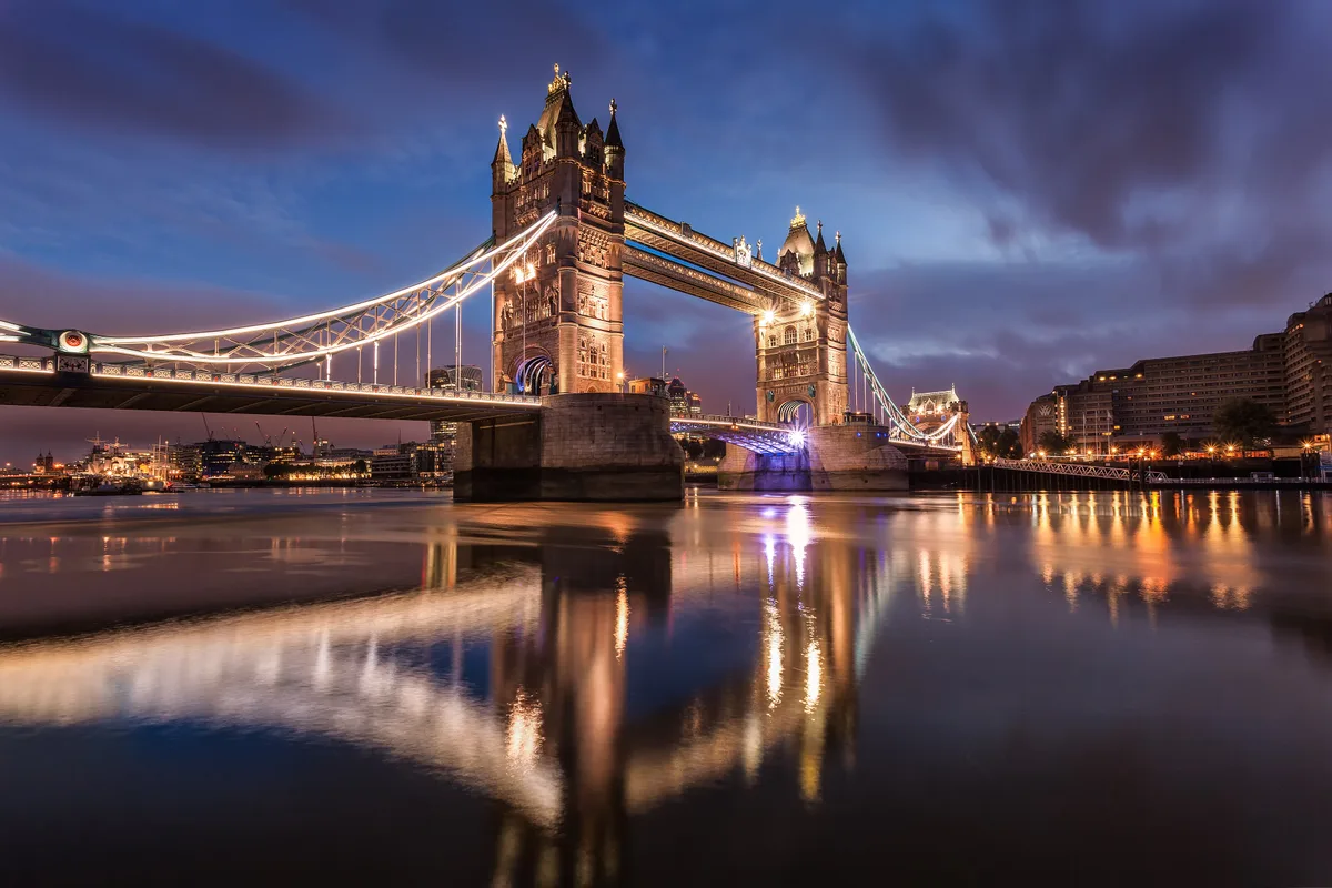 Tower Bridge in London - A combined bascule and suspension bridge with two 65-metre Victorian Gothic towers connected...