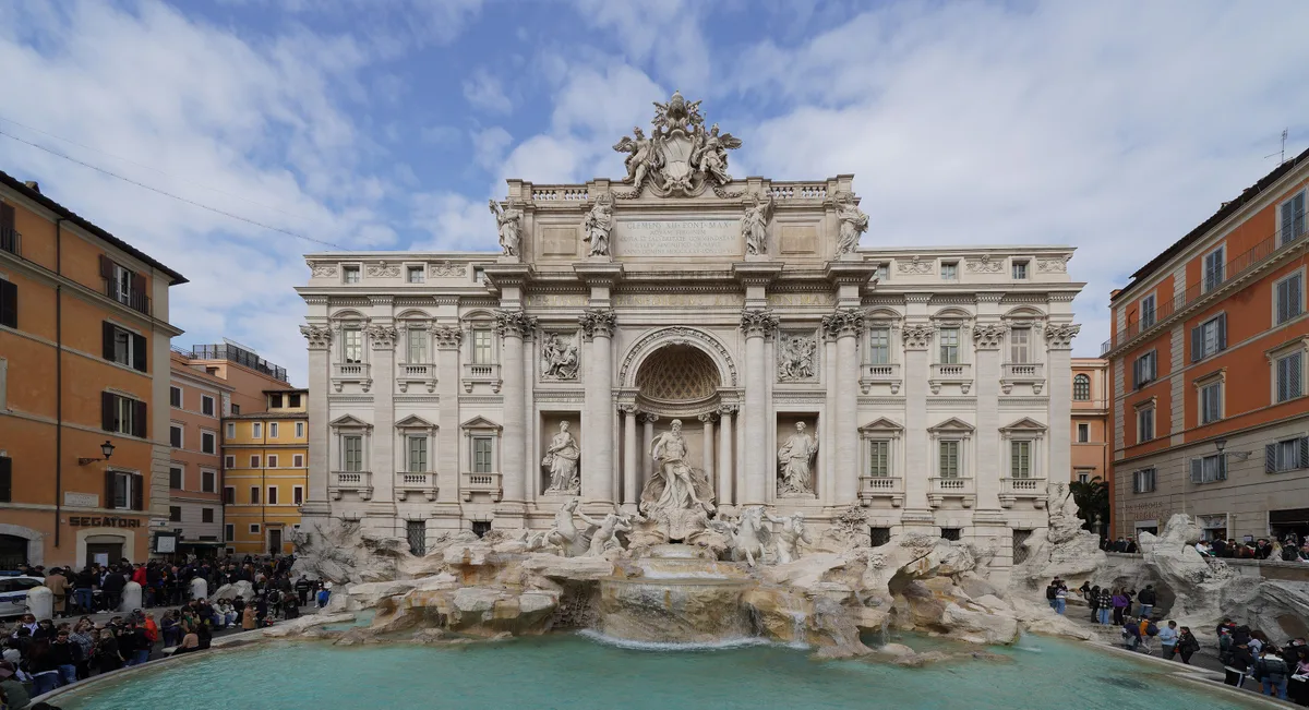Trevi Fountain in Rome - A monumental Baroque fountain built against the facade of the Palazzo Poli, with Oceanus...