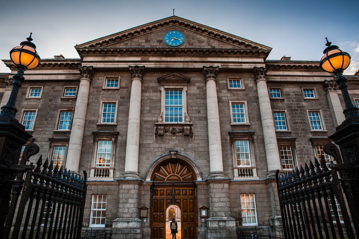 Trinity College Dublin & Old Library in Dublin - A sprawling granite Old Library with a balustraded roofline, fronted...
