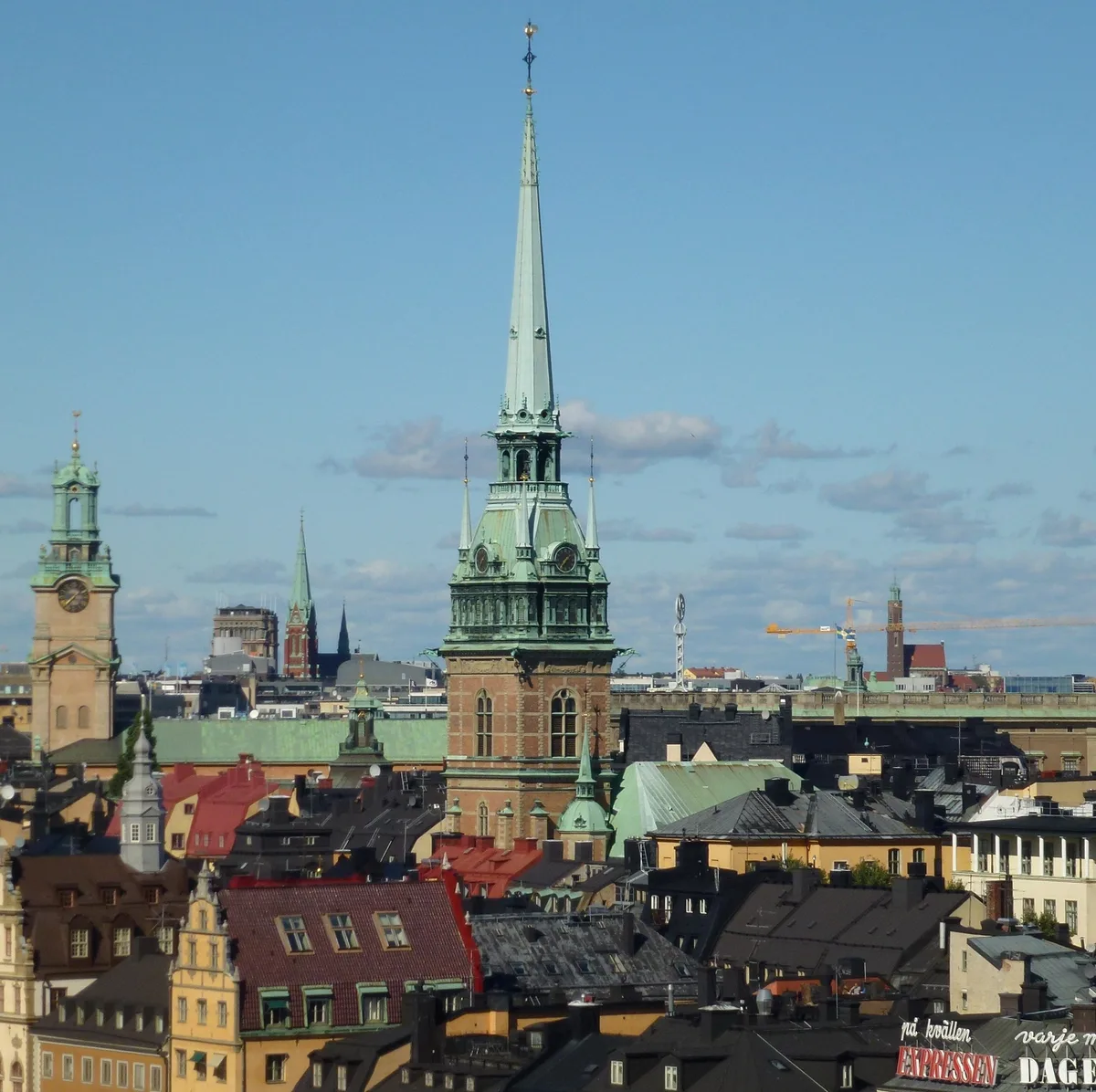 German Church in Stockholm - A tall red-brick church squeezed into the old town's narrow alleys, crowned by a copper...