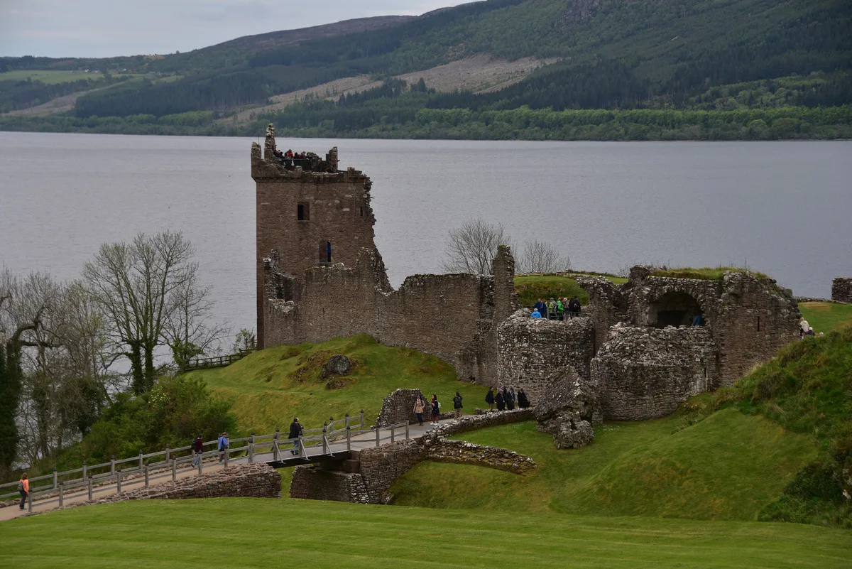 The ruined towers of Urquhart Castle on the shore of Loch Ness