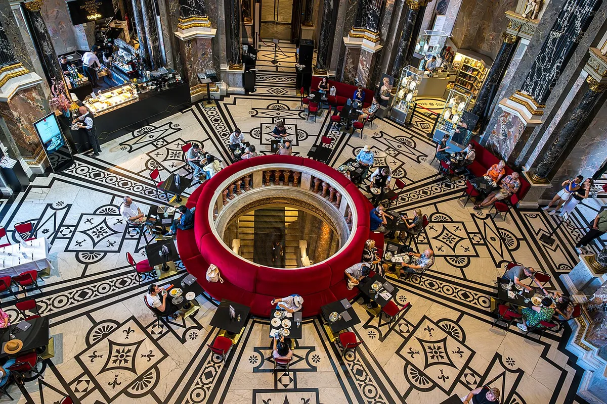 Kunsthistorisches Museum in Vienna - A symmetrical Renaissance-Revival palace of honey-coloured stone, its central cupola rising above a portico of paired columns, facing its twin museum across Maria-Theresien-Platz.