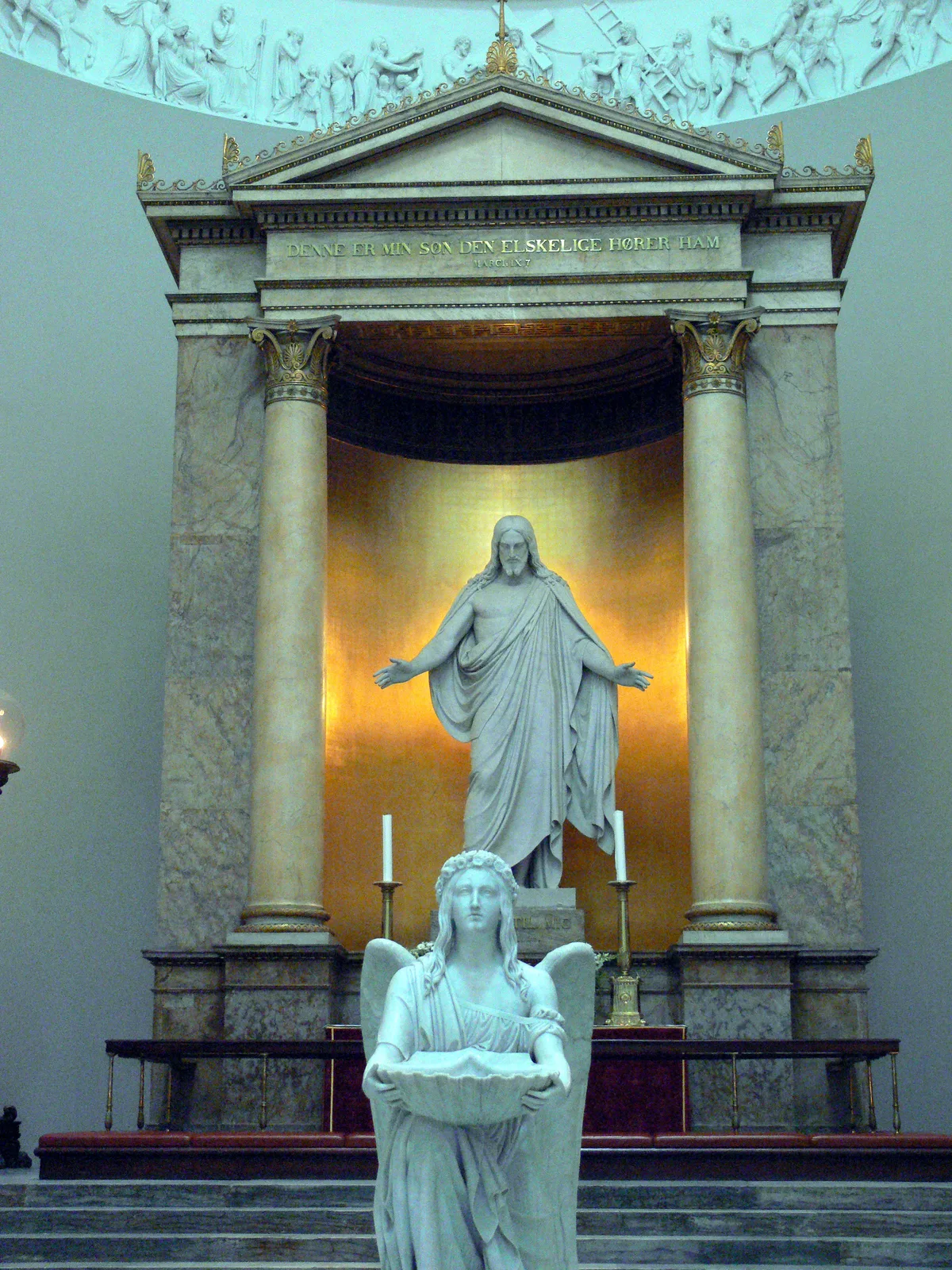 Church of Our Lady in Copenhagen - A broad neoclassical facade with a tall square tower and a colonnaded portico...