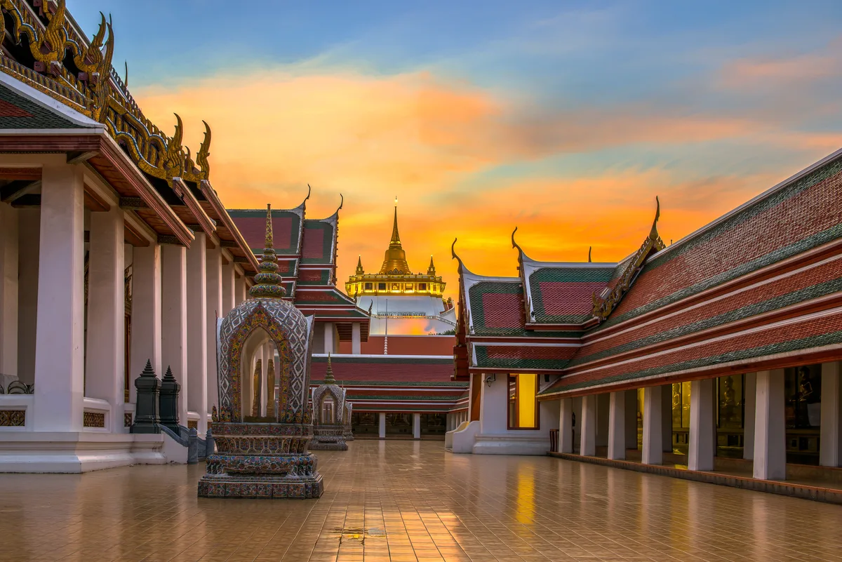 Wat Saket in Bangkok - A gleaming golden chedi atop an artificial hill rising roughly 77 metres above the surrounding...